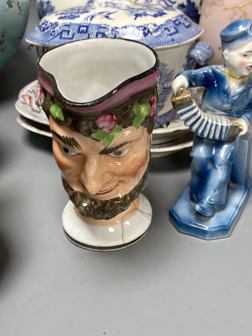 A 19th century pearlware Bacchus mask jug, a pair of Victorian pink opaline glass ewers and sundry items
